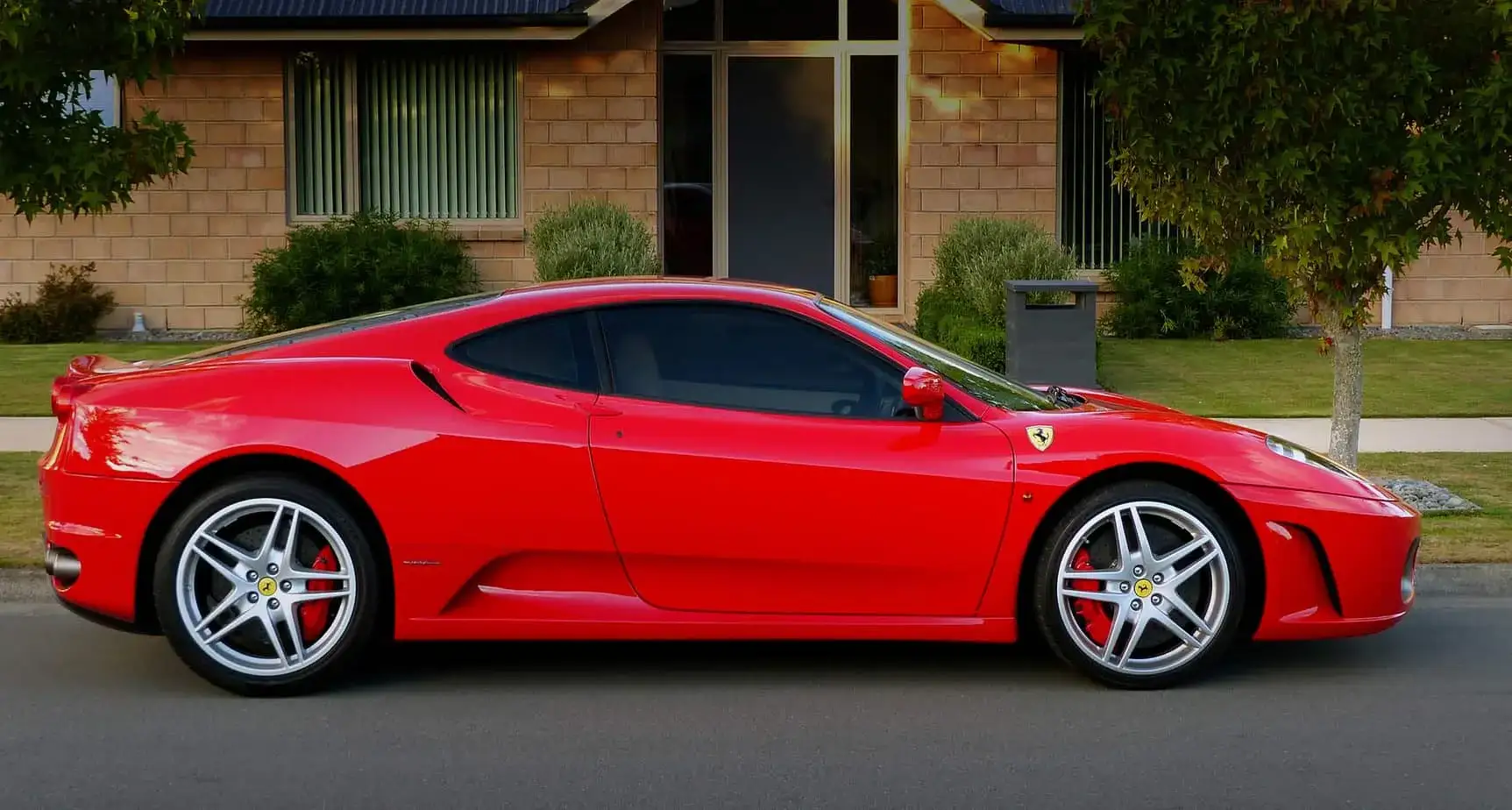 Vaughan exotic car on flatbed soft-strap transport