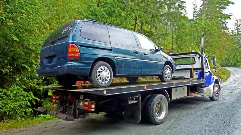 Vaughan flatbed towing a cargo van