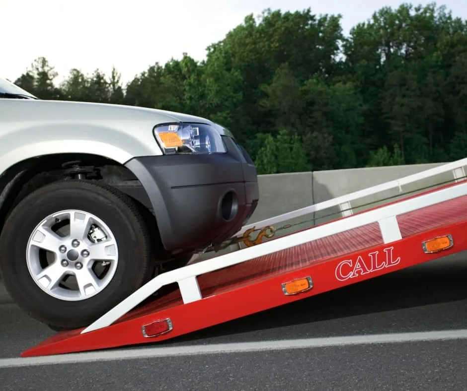 Vaughan tow truck loading a vehicle on a residential street