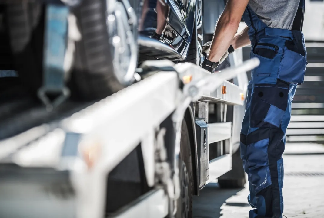 Vaughan tow truck driver loading a car onto a flatbed