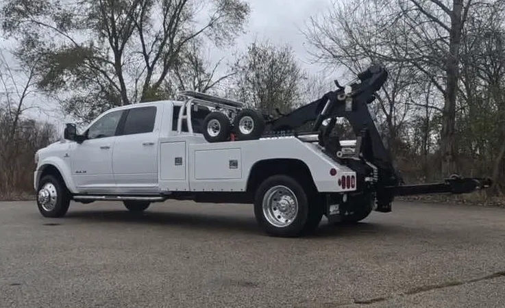 Vaughan wrecker equipment securing damaged vehicle